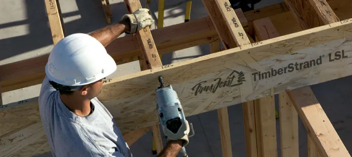 Builder fastening a TimberStrand beam